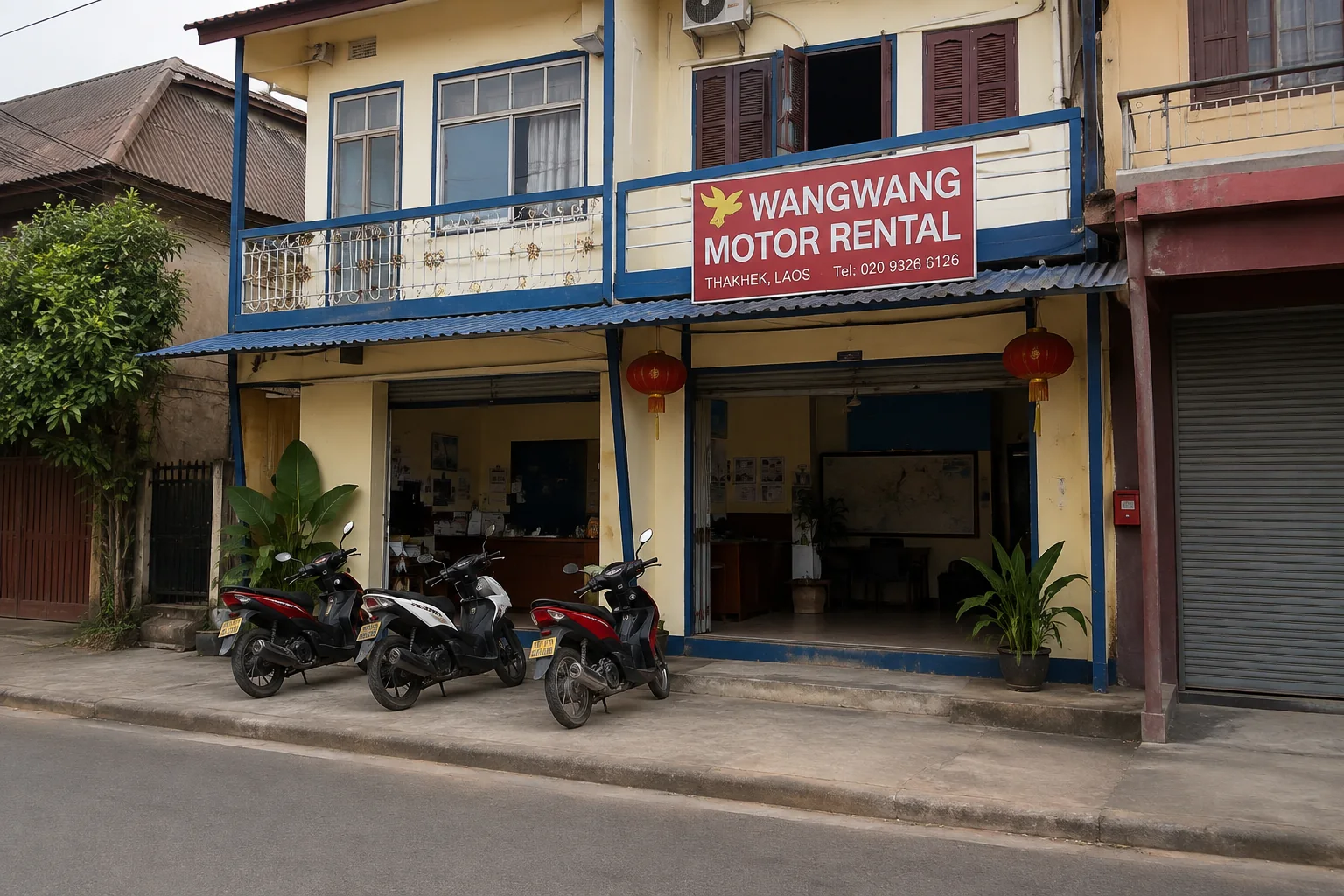 Wang Wang Motor Rental storefront and scooters in Thakhek