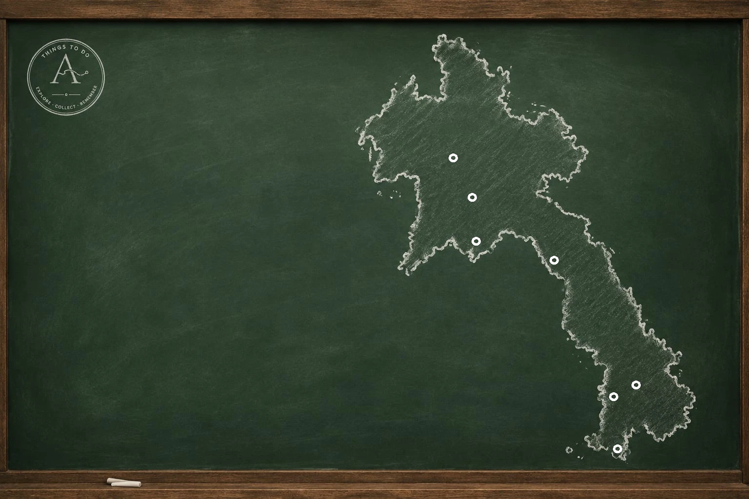 A chalk illustration of the map of Laos on a green framed chalkboard.